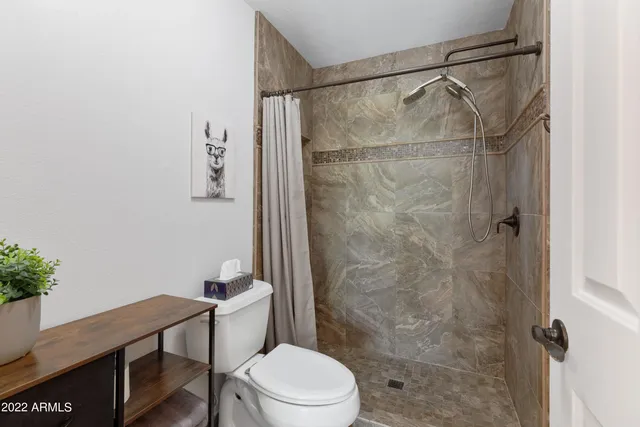 a bedroom with a bed and cabinets