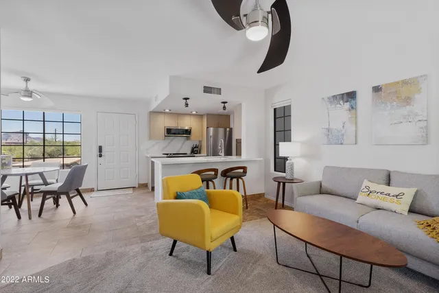 a view of a backyard with plants and patio