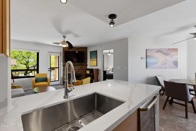 a view of a balcony with two chairs