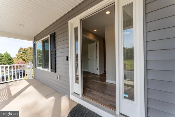 a view of livingroom with hardwood floor and window with wooden floor