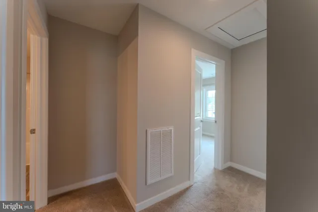 a front view of a house with a wooden fence