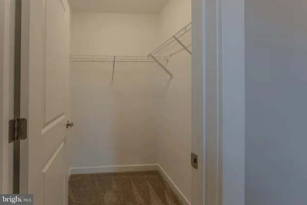 a view of a house with a patio and a yard