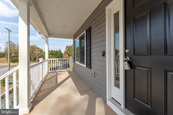 a view of a balcony from a hallway