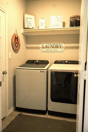 a utility room with washer and dryer