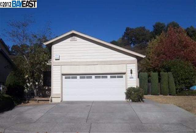 a view of a house with a yard and garage