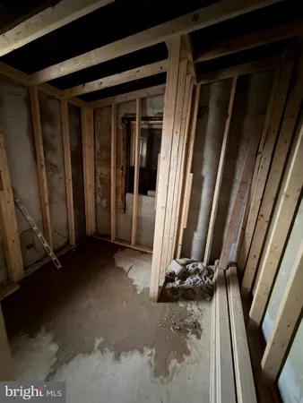 a view of an empty room with stairs