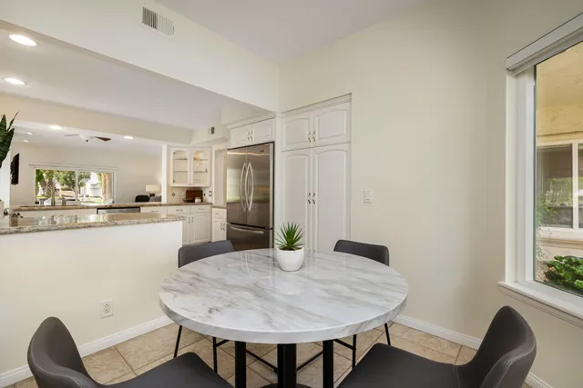 a living room with fireplace furniture and a flat screen tv