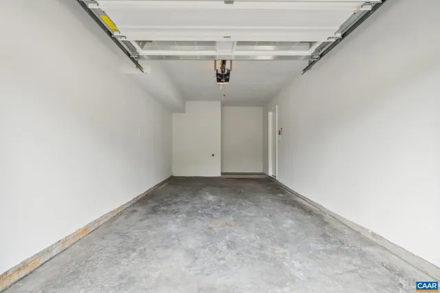 a front view of a residential apartment building with a yard