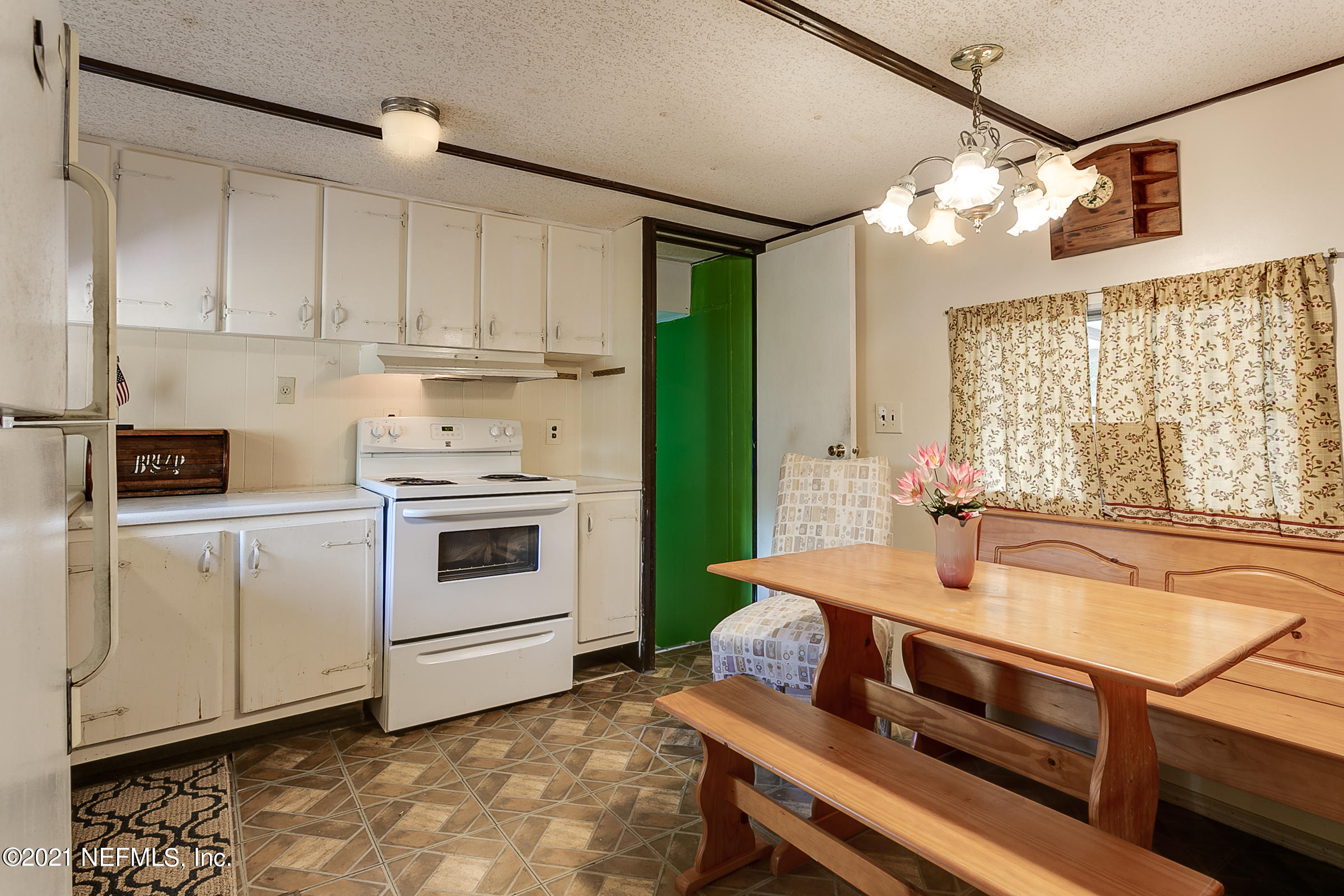 7004 Deer Springs Road Keystone Heights, FL 32656 - Photo 12 of 25 a kitchen with sink stove and cabinets