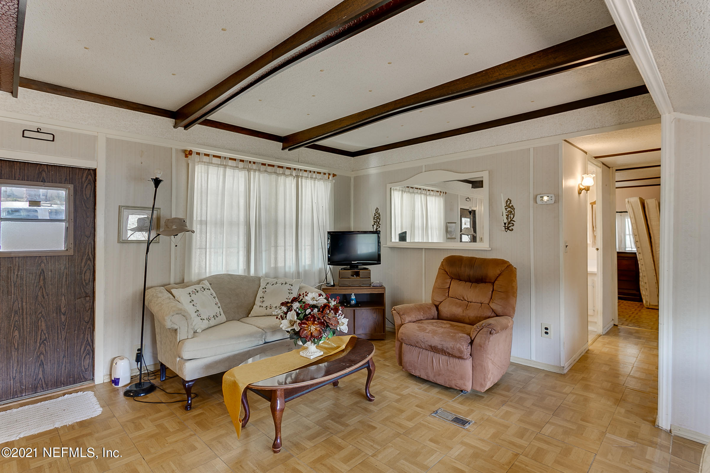 7004 Deer Springs Road Keystone Heights, FL 32656 - Photo 15 of 25 a living room with furniture and a flat screen tv