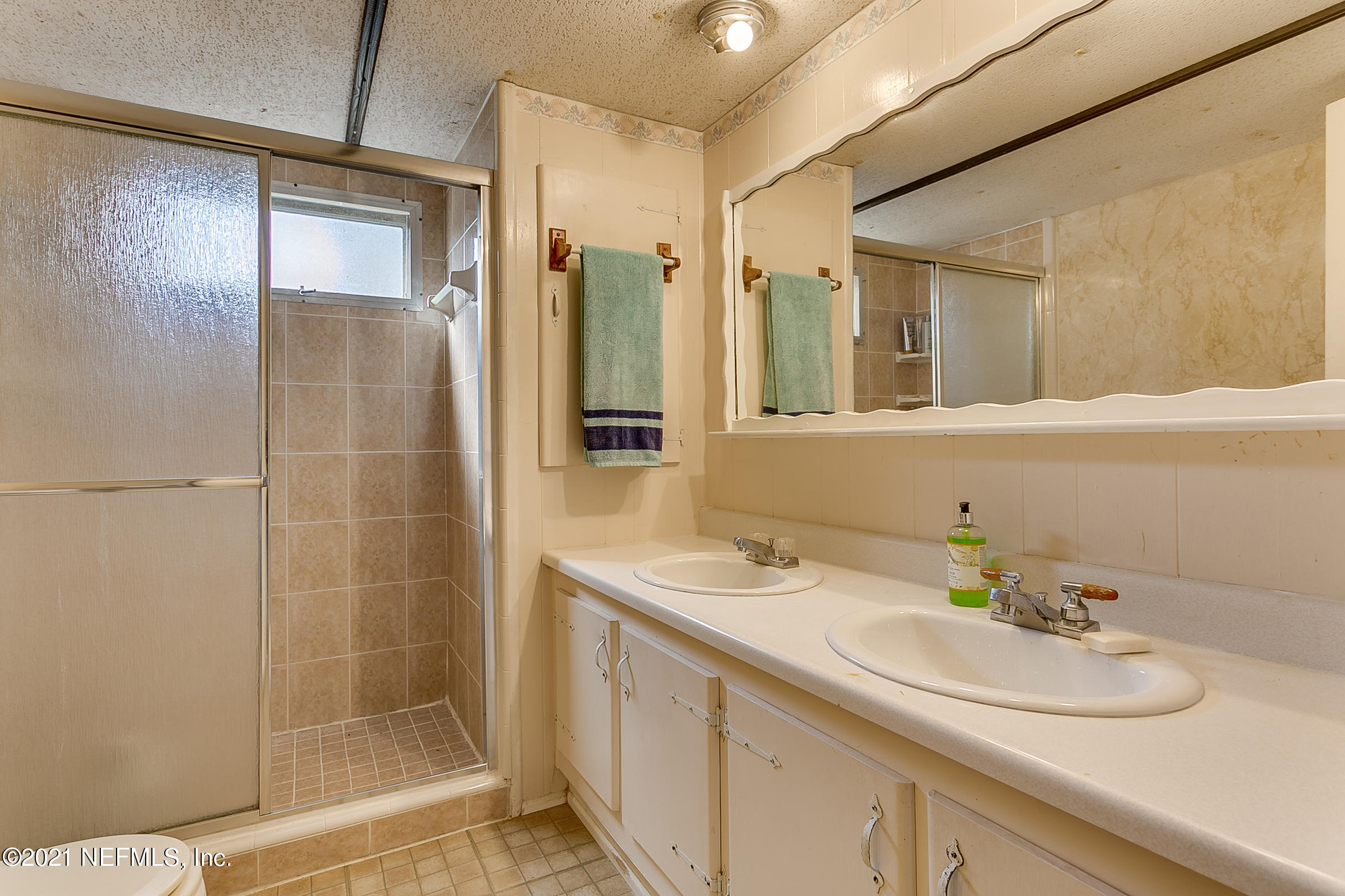 7004 Deer Springs Road Keystone Heights, FL 32656 - Photo 22 of 25 a bathroom with a sink and a mirror
