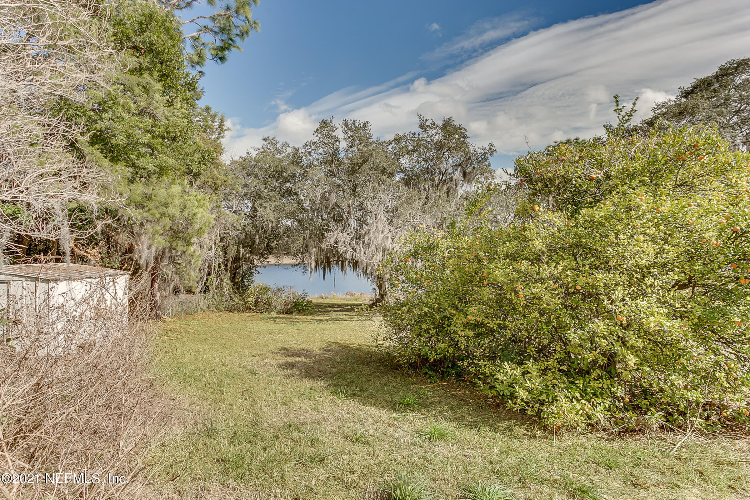 7004 Deer Springs Road Keystone Heights, FL 32656 - Photo 3 of 25 a view of a yard with an outdoor space