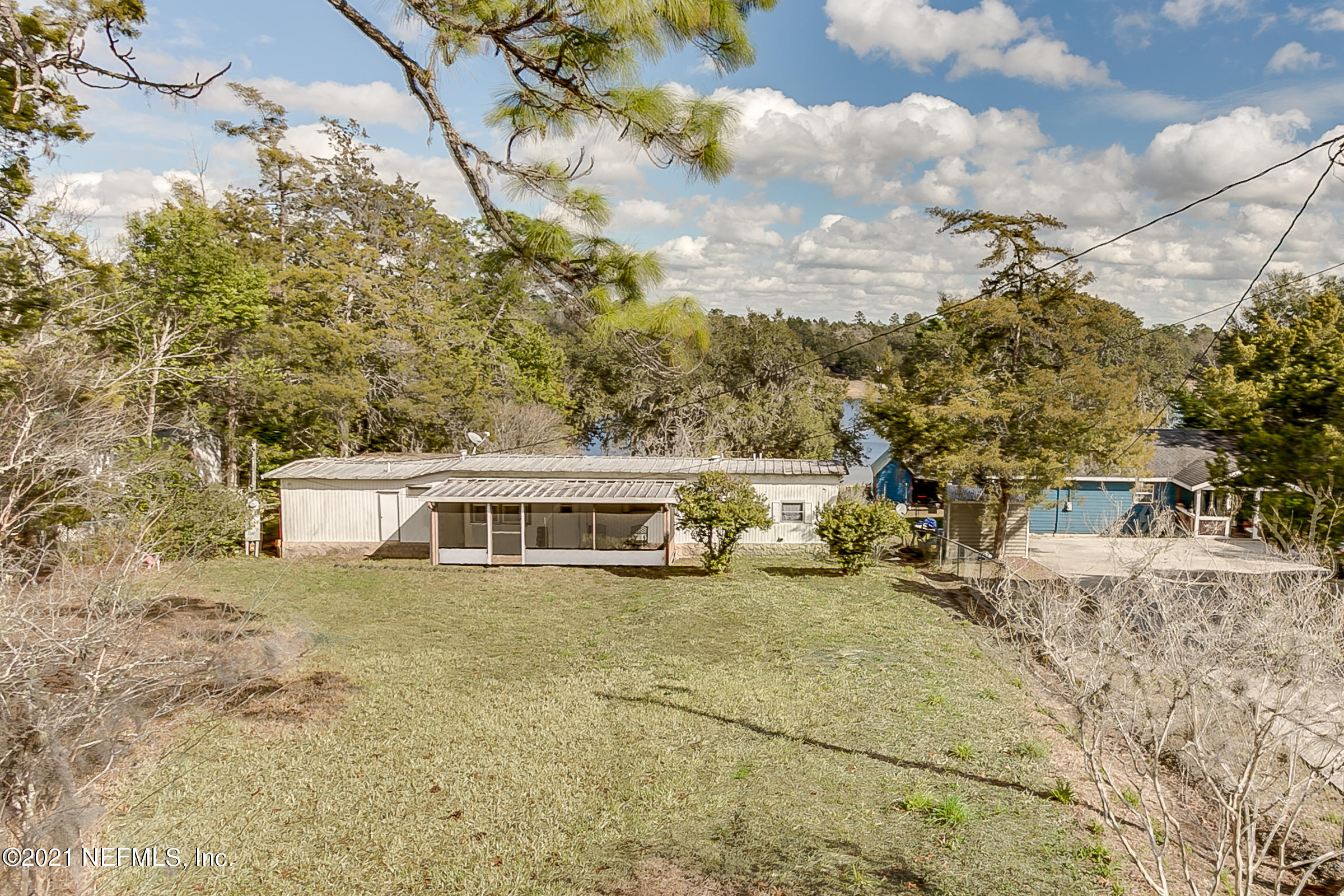 7004 Deer Springs Road Keystone Heights, FL 32656 - Photo 6 of 25 a view of a house with a yard and sitting area