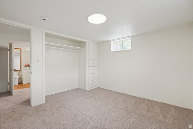 673 East 700 South Springville, UT 84663 - Photo 32 of 43 Room with neutral-toned carpet, built-in open closet with shelving, built-in dresser with four drawers, a window, and a flush-mount ceiling light fixture