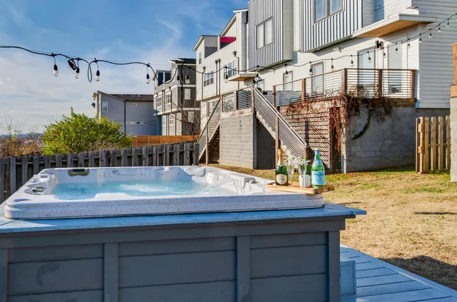 a white toilet sitting next to a shower curtain