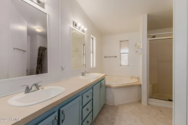 a bathroom with a toilet and shower