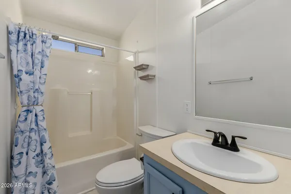a view of a storage & utility room with closet dryer