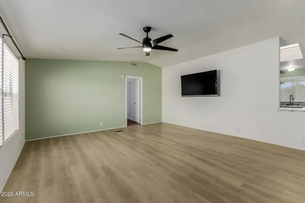 a view of an empty room with a window