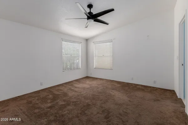 a view of a livingroom with a ceiling fan & dryer