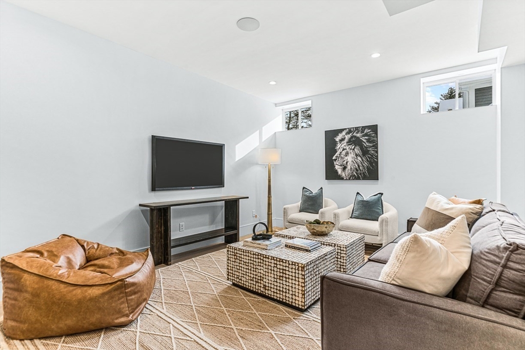 123 Lawton Road Needham, MA 02492 - Photo 12 of 16 a living room with furniture and a flat screen tv