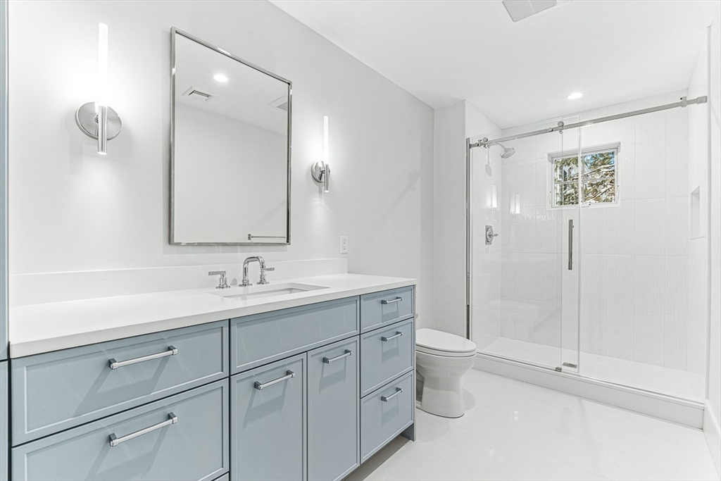 123 Lawton Road Needham, MA 02492 - Photo 15 of 16 a bathroom with a toilet sink and mirror