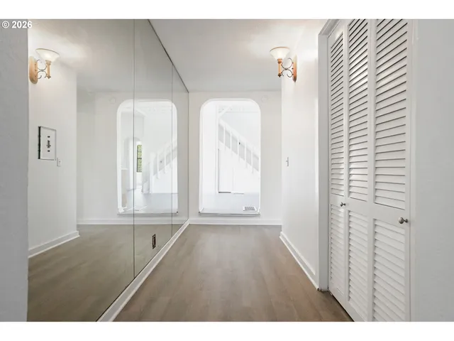 a kitchen with a stove a refrigerator and a sink