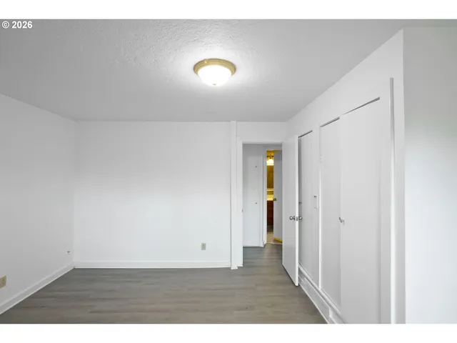 a living room with furniture a flat screen tv and a floor to ceiling window