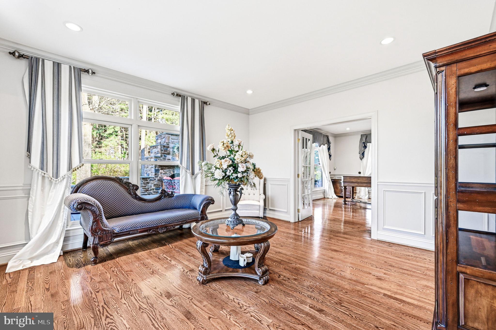 1714 Hickory Hill Road Chadds Ford, PA 19317 - Photo 12 of 82 a living room with furniture a table and a large window