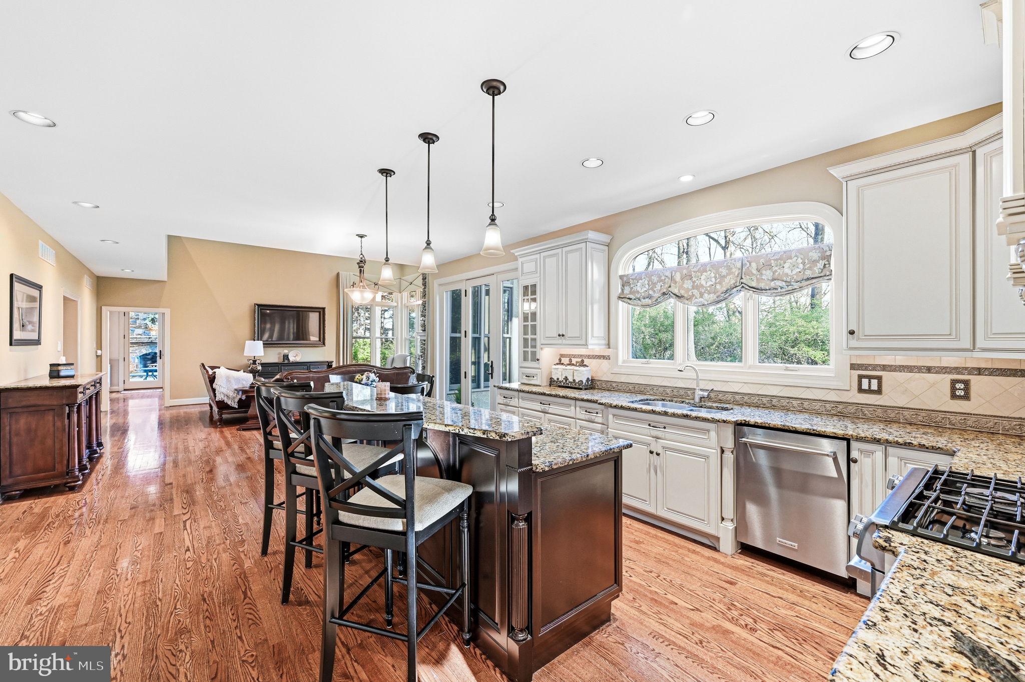 1714 Hickory Hill Road Chadds Ford, PA 19317 - Photo 25 of 82 a view of a dining room and livingroom with furniture wooden floor a chandelier