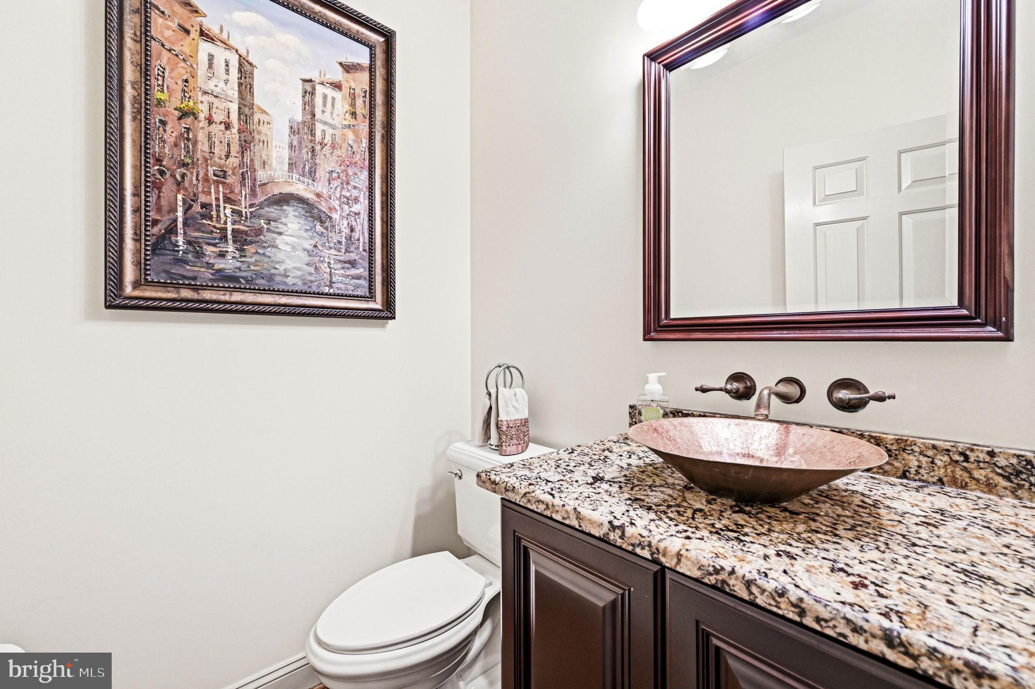 1714 Hickory Hill Road Chadds Ford, PA 19317 - Photo 28 of 82 a bathroom with a granite countertop toilet sink and mirror