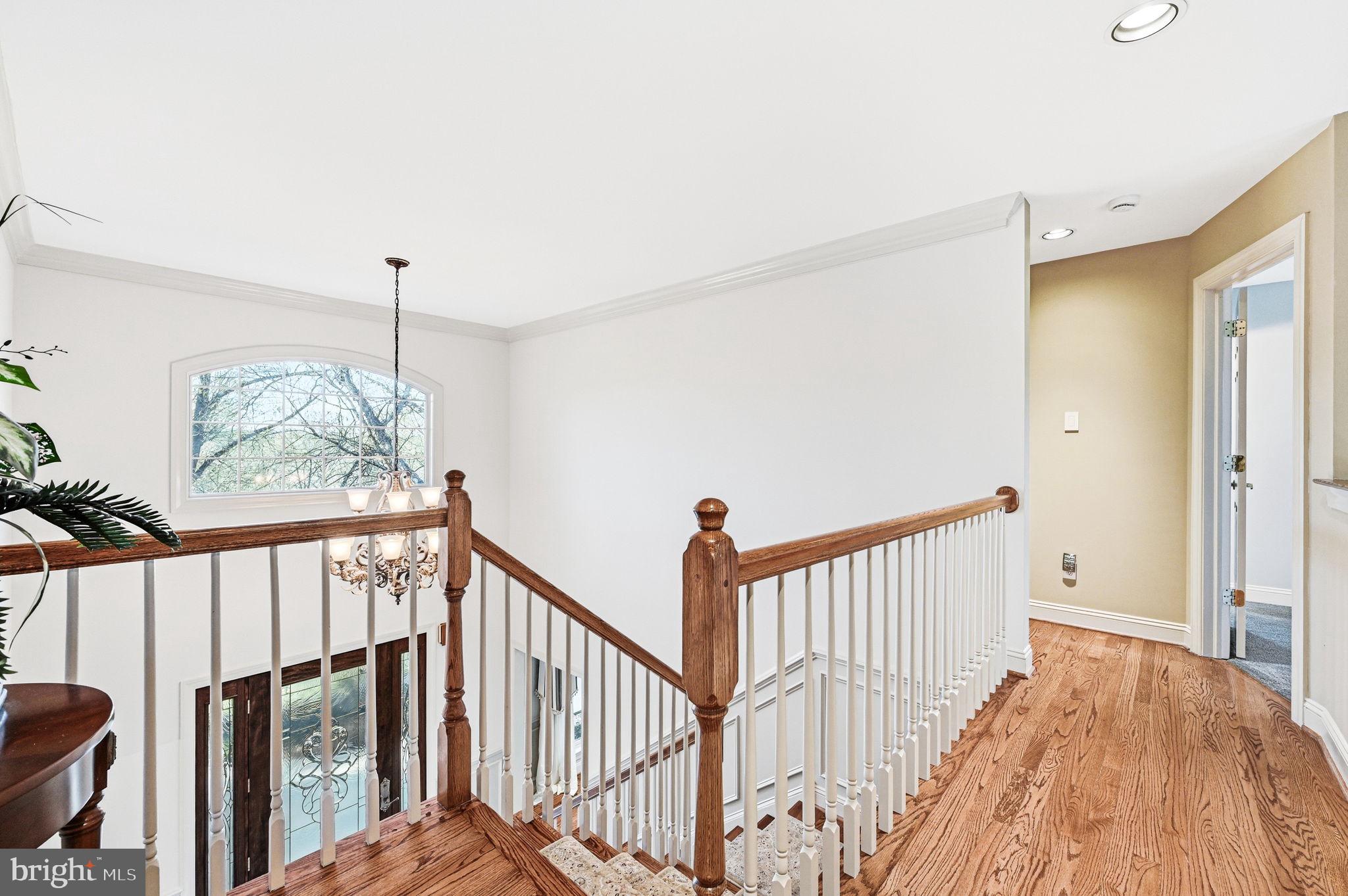 1714 Hickory Hill Road Chadds Ford, PA 19317 - Photo 30 of 82 a view of a hallway with wooden floor and staircase