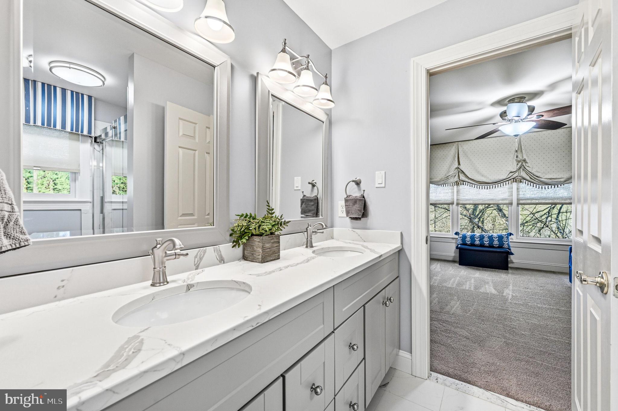 1714 Hickory Hill Road Chadds Ford, PA 19317 - Photo 33 of 82 a bathroom with a double vanity sink and a mirror