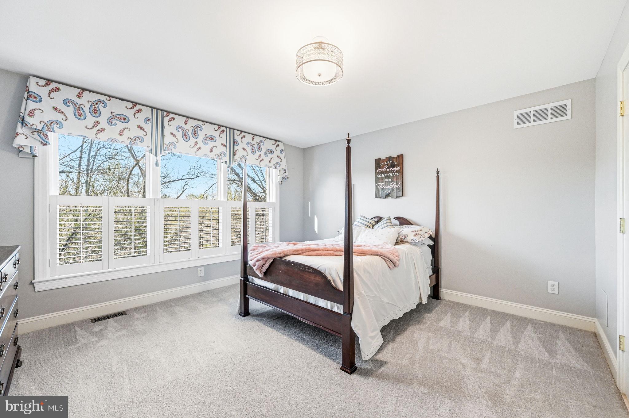 1714 Hickory Hill Road Chadds Ford, PA 19317 - Photo 36 of 82 a bed sitting in a bedroom next to a window