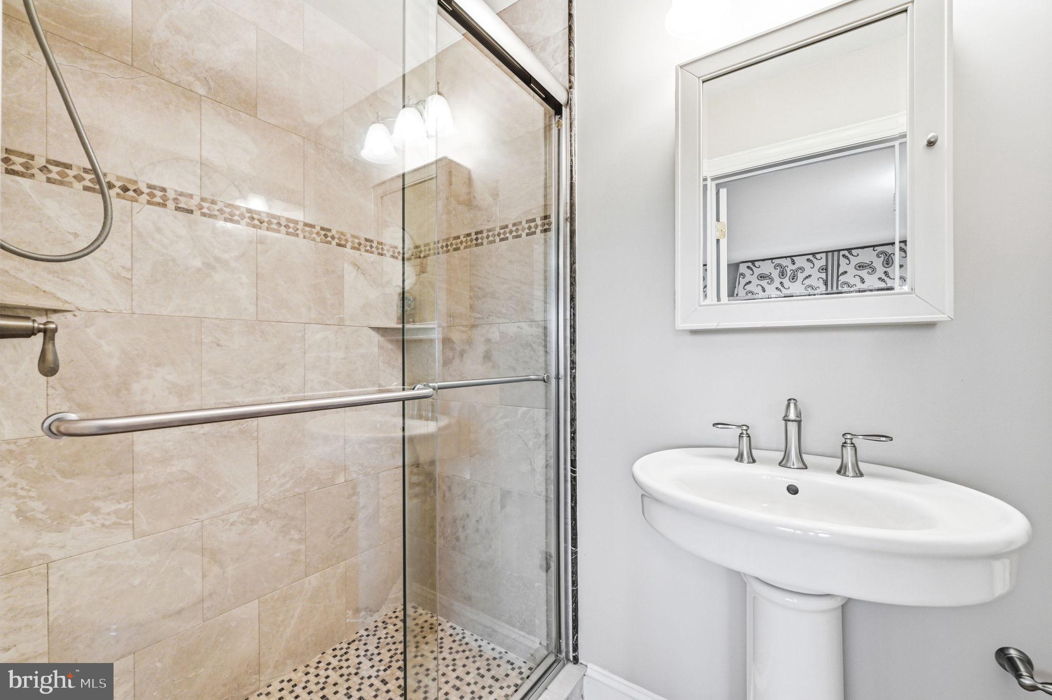 1714 Hickory Hill Road Chadds Ford, PA 19317 - Photo 38 of 82 a bathroom with a sink and a mirror