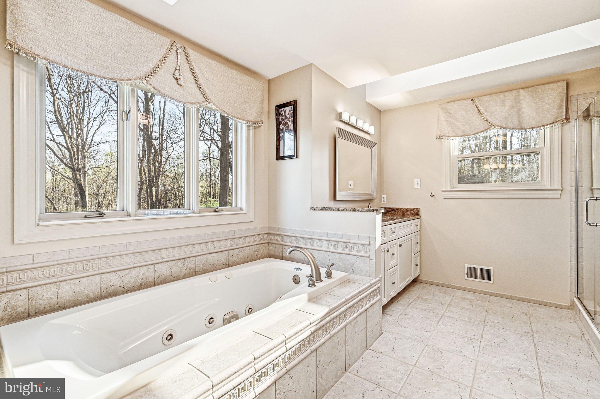 1714 Hickory Hill Road Chadds Ford, PA 19317 - Photo 45 of 82 a bathroom with a bathtub and a shower