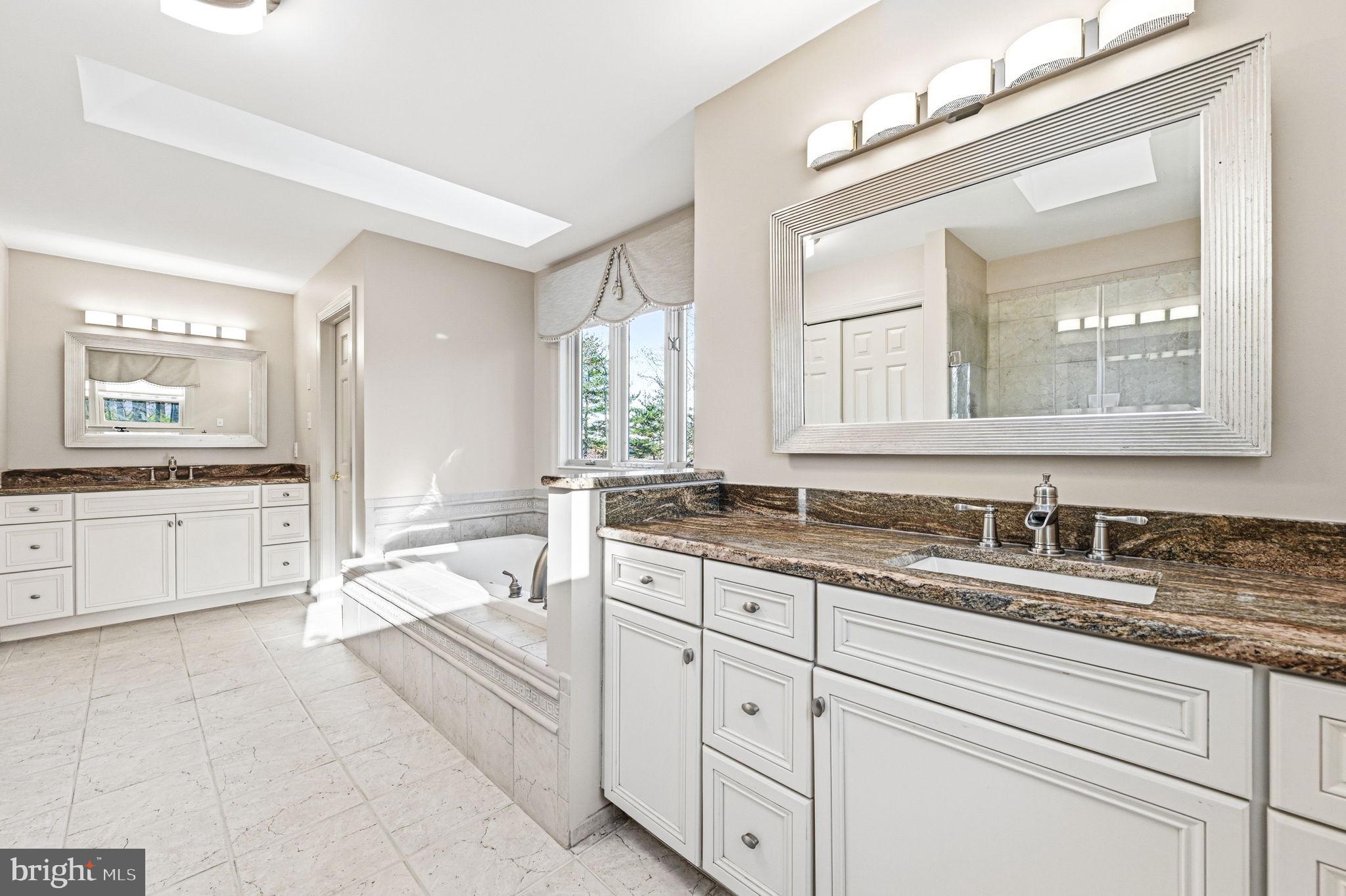 1714 Hickory Hill Road Chadds Ford, PA 19317 - Photo 46 of 82 a spacious bathroom with a granite countertop sink mirror and a