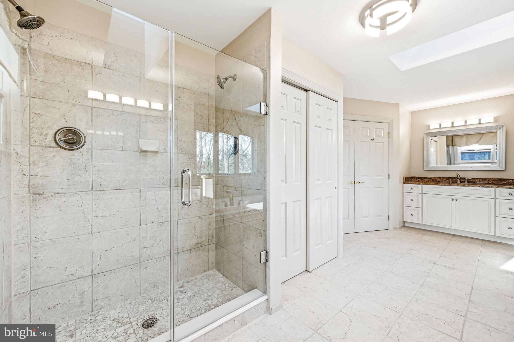 1714 Hickory Hill Road Chadds Ford, PA 19317 - Photo 47 of 82 a bathroom with a shower sink and mirror