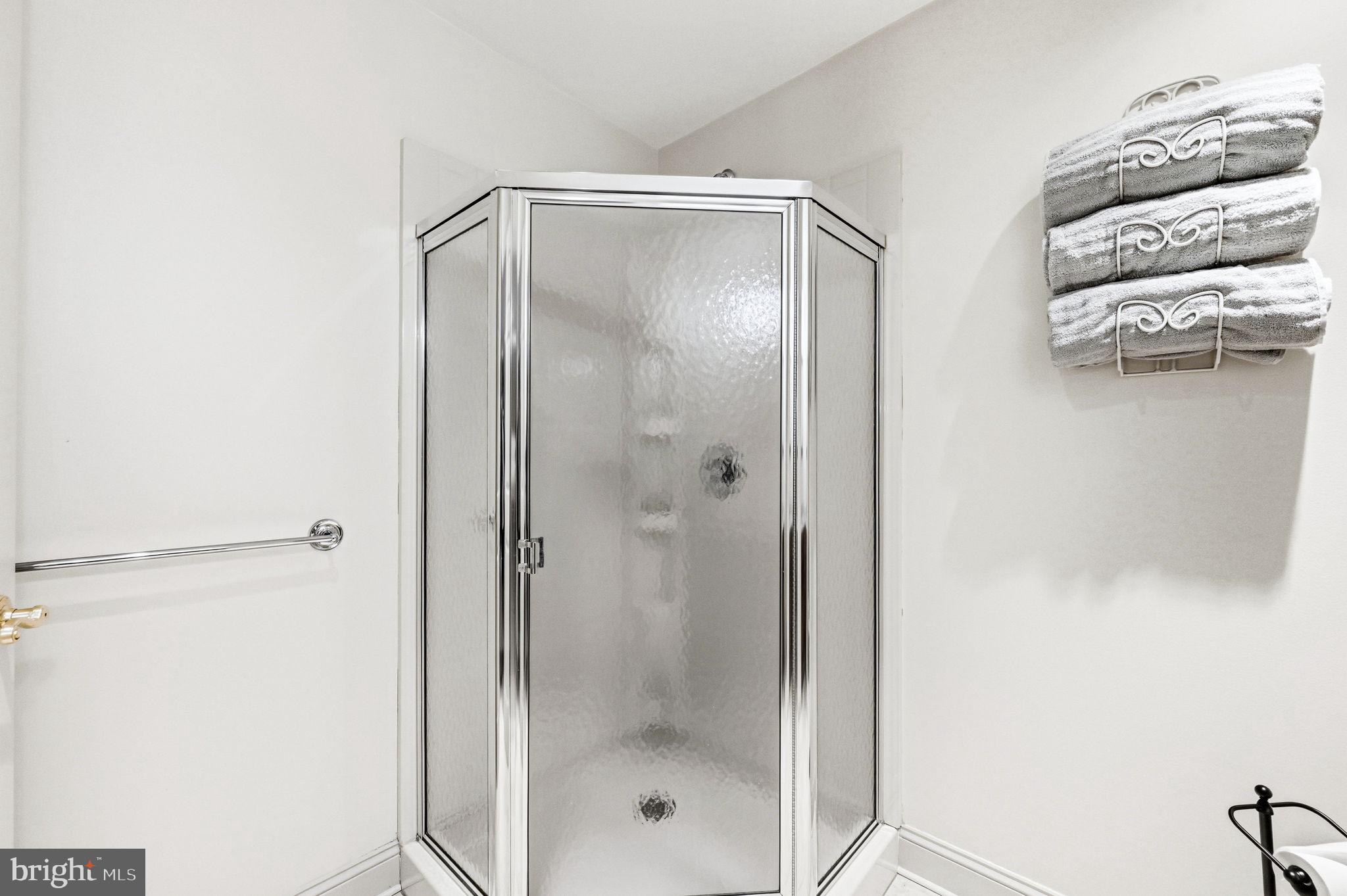 1714 Hickory Hill Road Chadds Ford, PA 19317 - Photo 55 of 82 a bathroom with a glass shower door