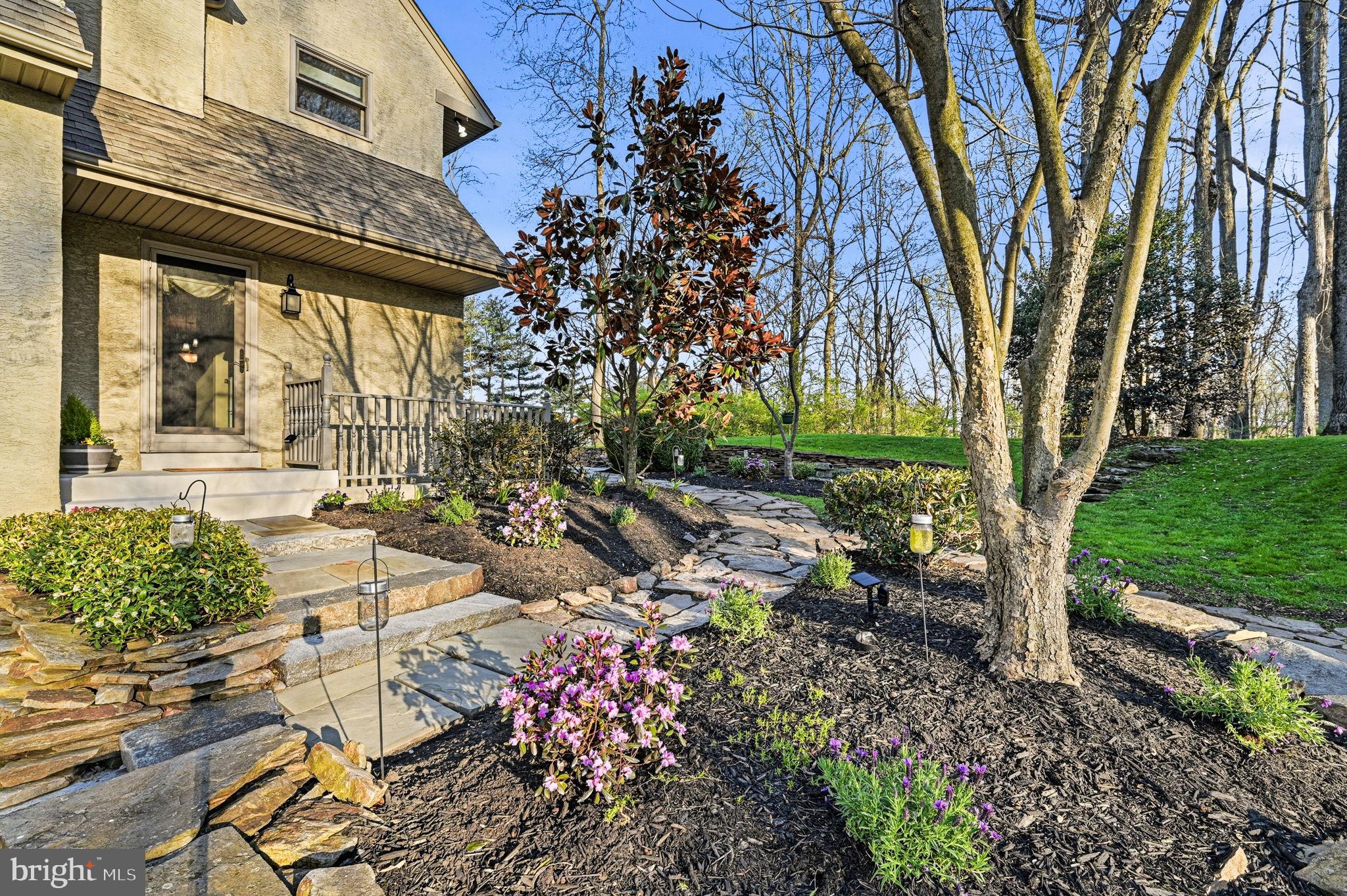 1714 Hickory Hill Road Chadds Ford, PA 19317 - Photo 59 of 82 a view of backyard with a table and chairs and potted plants