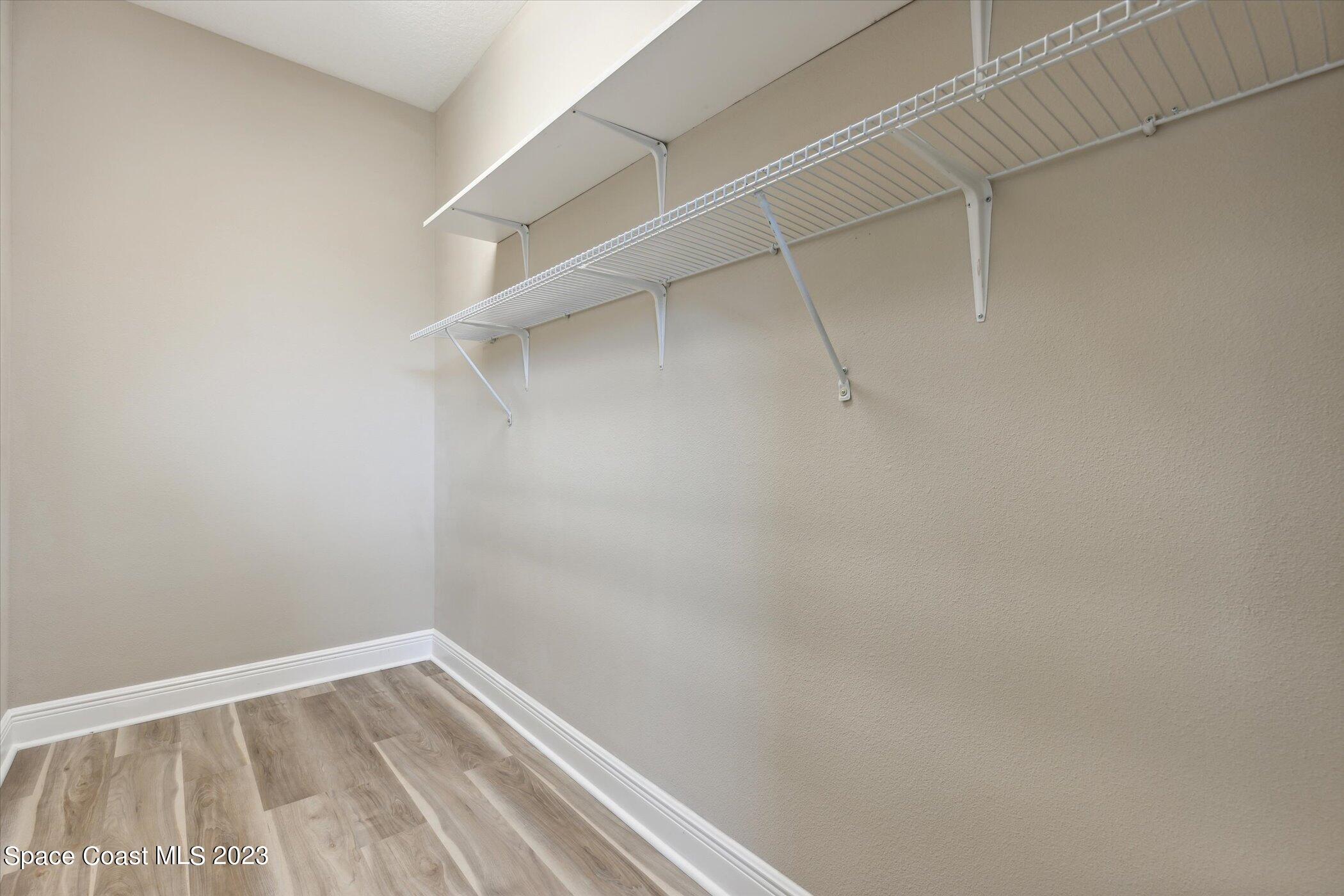 3611 Stabane Place Melbourne, FL 32940 - Photo 22 of 50 a view of a room with racks on the wall