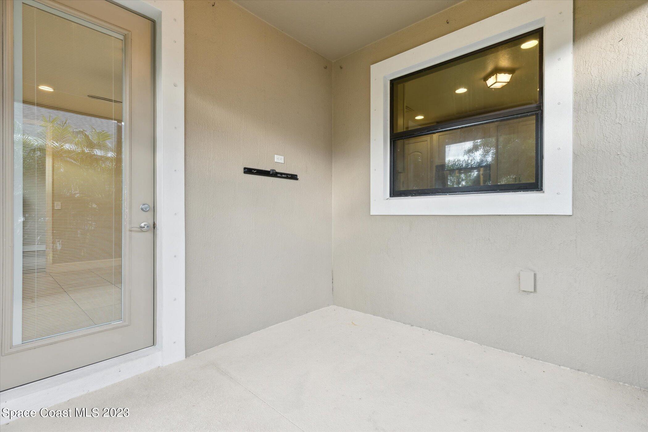 3611 Stabane Place Melbourne, FL 32940 - Photo 33 of 50 a room with a large mirror and shower