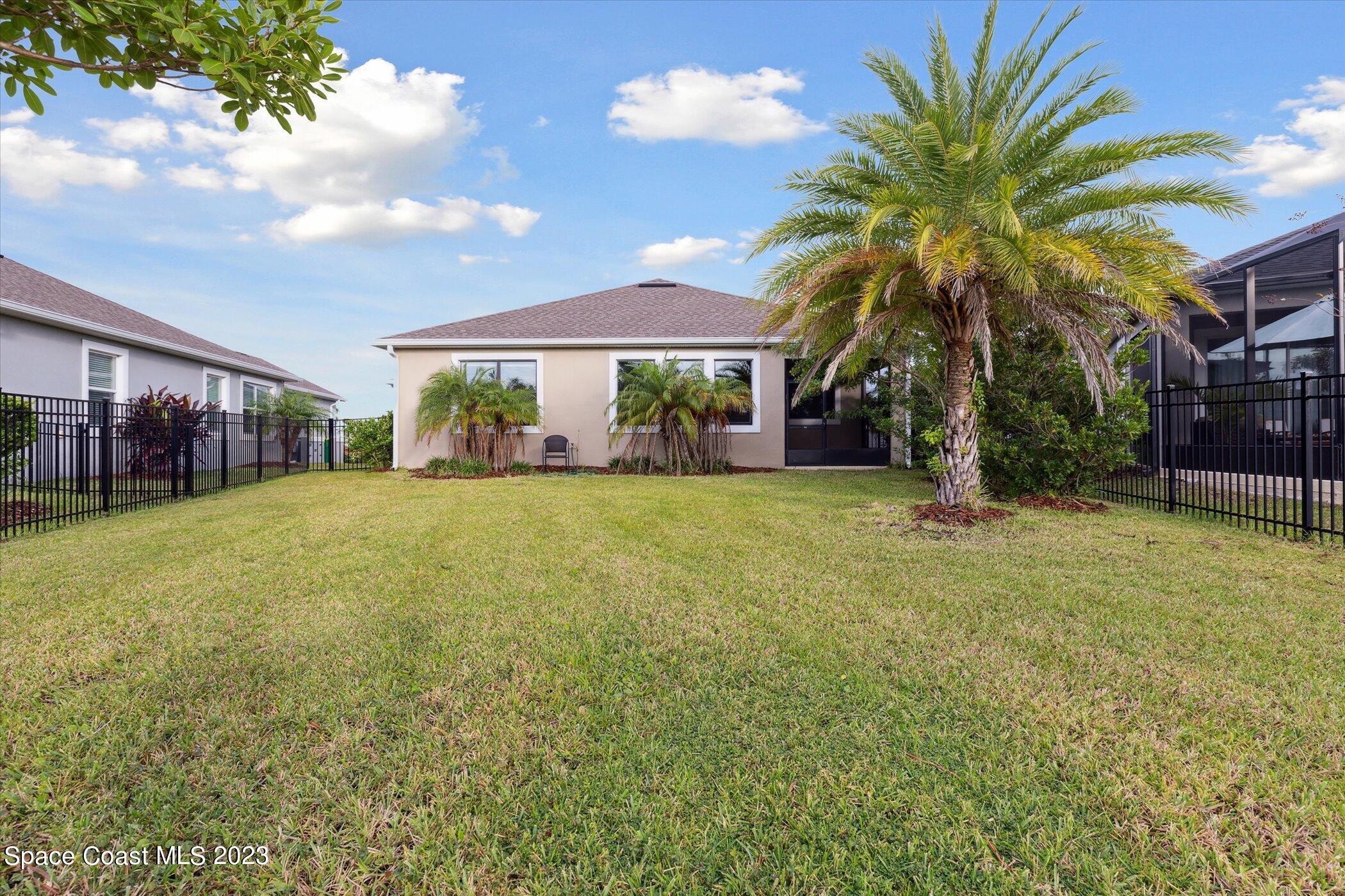 3611 Stabane Place Melbourne, FL 32940 - Photo 36 of 50 a front view of house with yard and green space