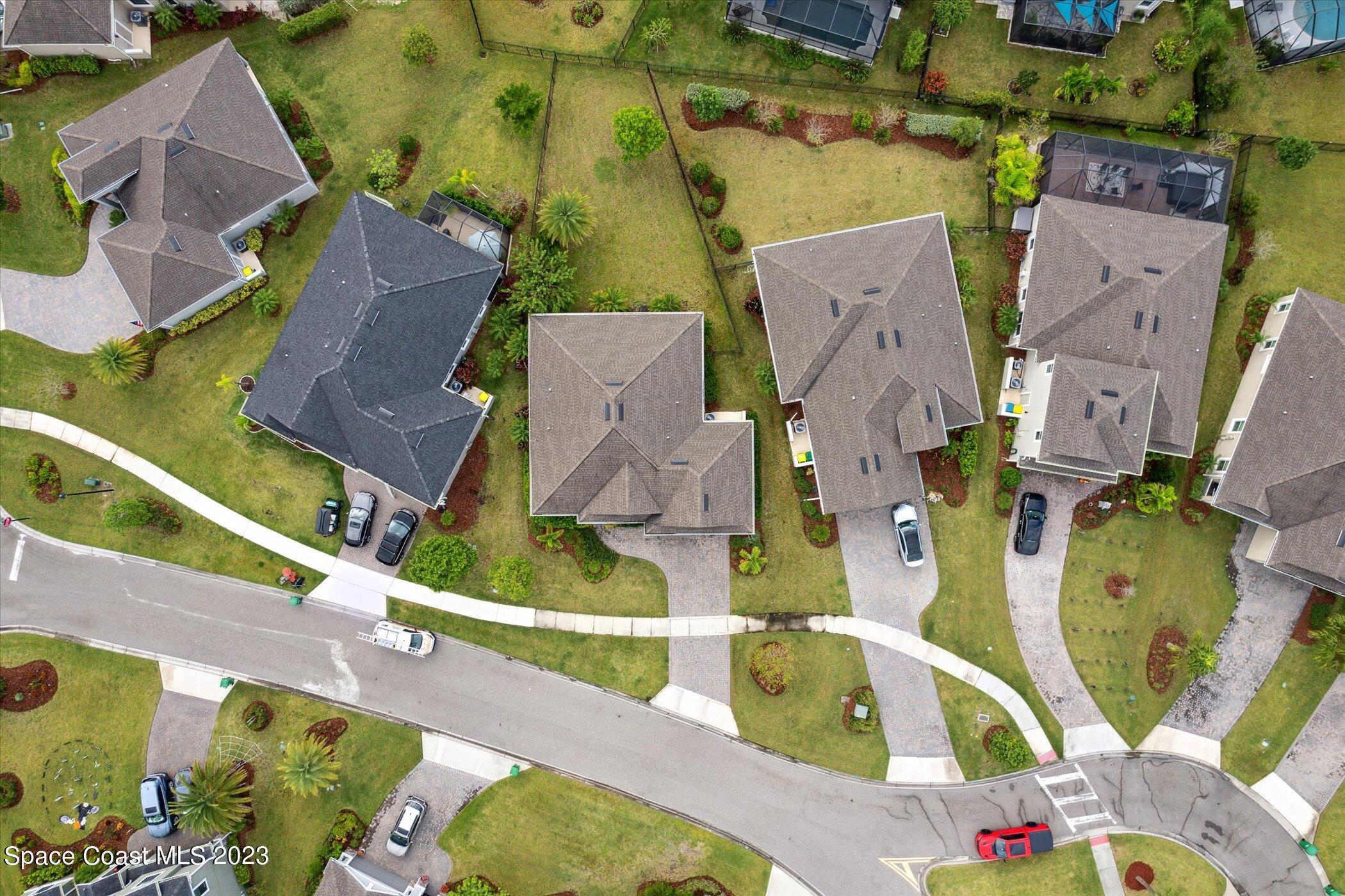 3611 Stabane Place Melbourne, FL 32940 - Photo 42 of 50 an aerial view of residential house with outdoor space and parking