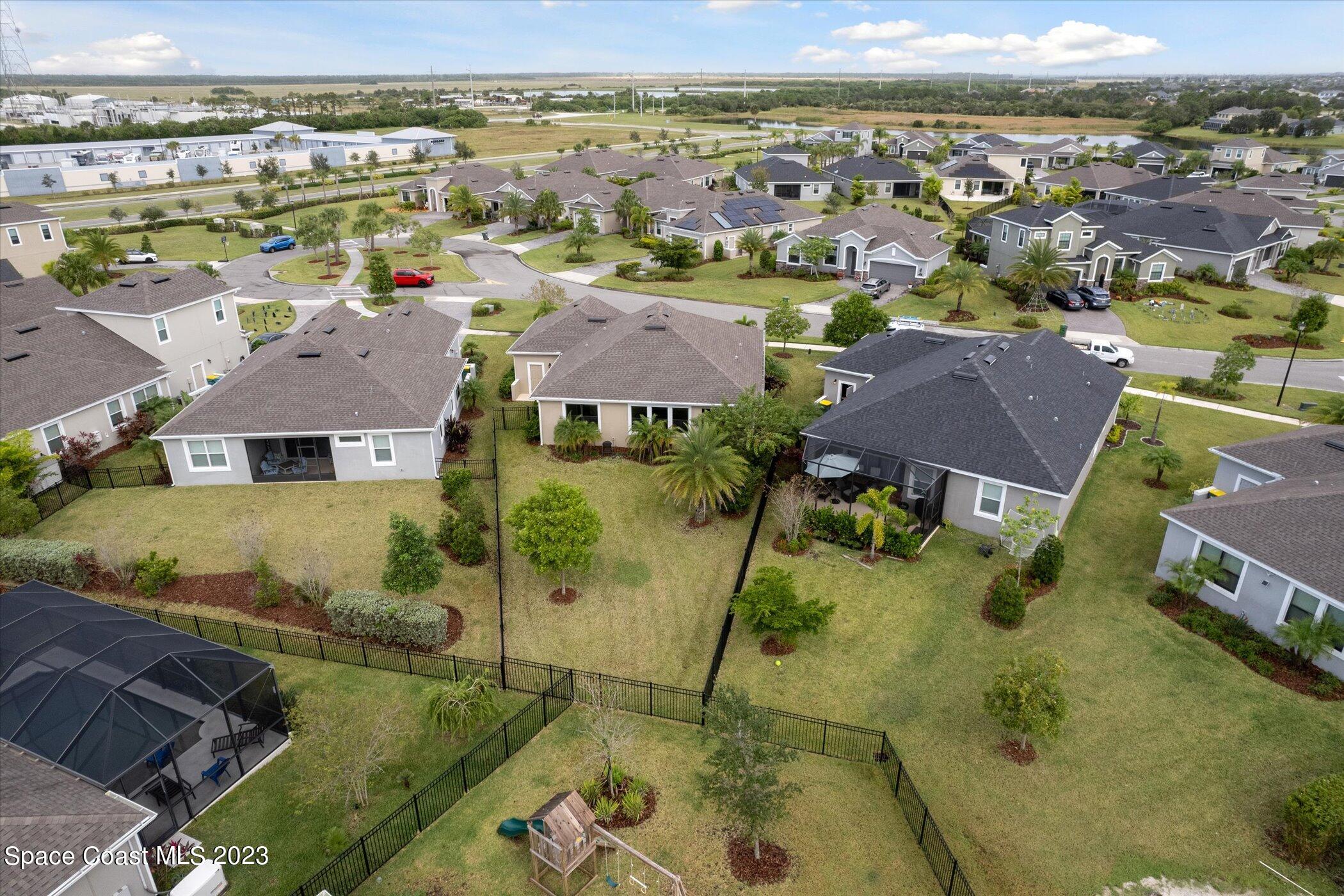 3611 Stabane Place Melbourne, FL 32940 - Photo 44 of 50 an aerial view of residential houses with outdoor space