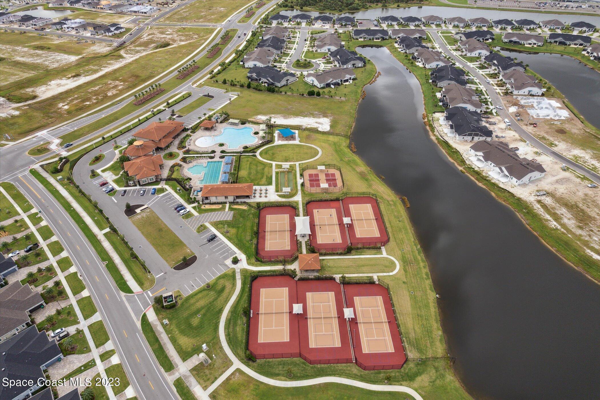 3611 Stabane Place Melbourne, FL 32940 - Photo 47 of 50 an aerial view of a swimming pool with a yard