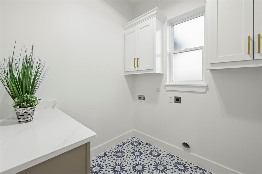 1000 Canyon Lake Road Wills Point, TX 75169 - Photo 21 of 40 Washroom with hookup for a washing machine, baseboards, tile patterned floors, cabinet space, and electric dryer hookup