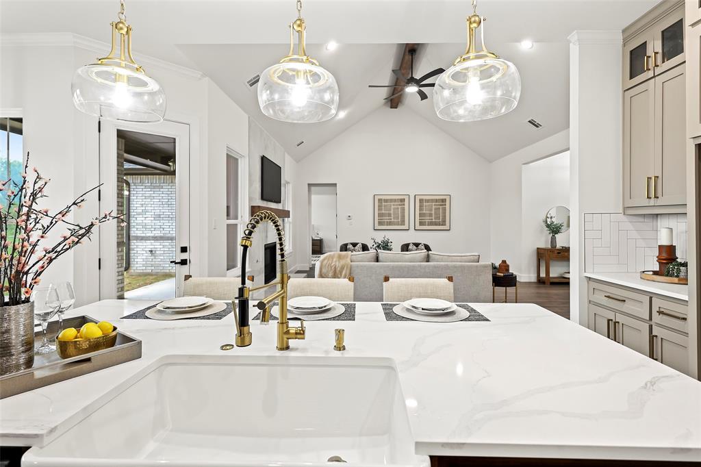 1000 Canyon Lake Road Wills Point, TX 75169 - Photo 40 of 40 Kitchen featuring open floor plan, a sink, gray cabinetry, and ceiling fan