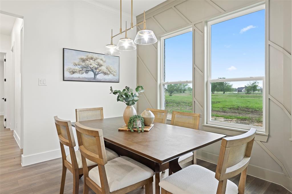 1000 Canyon Lake Road Wills Point, TX 75169 - Photo 4 of 40 Dining room featuring baseboards, ornamental molding, and light wood finished floors