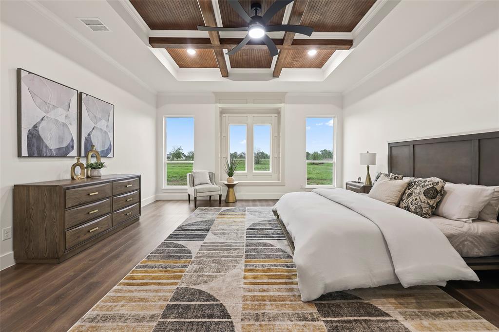 1000 Canyon Lake Road Wills Point, TX 75169 - Photo 9 of 40 Bedroom featuring coffered ceiling, ornamental molding, and dark wood-style flooring