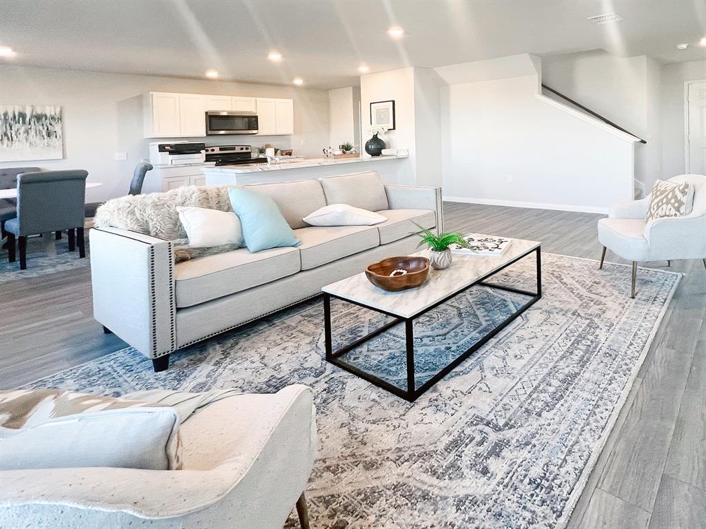 346 Azalea Trail Granbury, TX 76048 - Photo 4 of 11 a living room with furniture and a rug